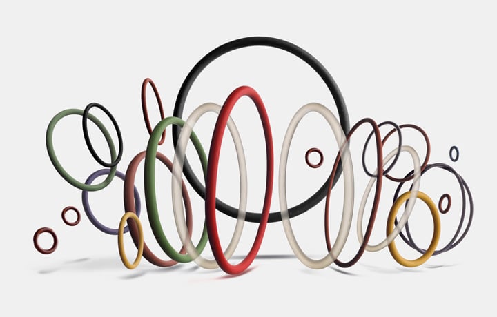 Selection of industrial O-rings and static seals in various materials and colours on a white background